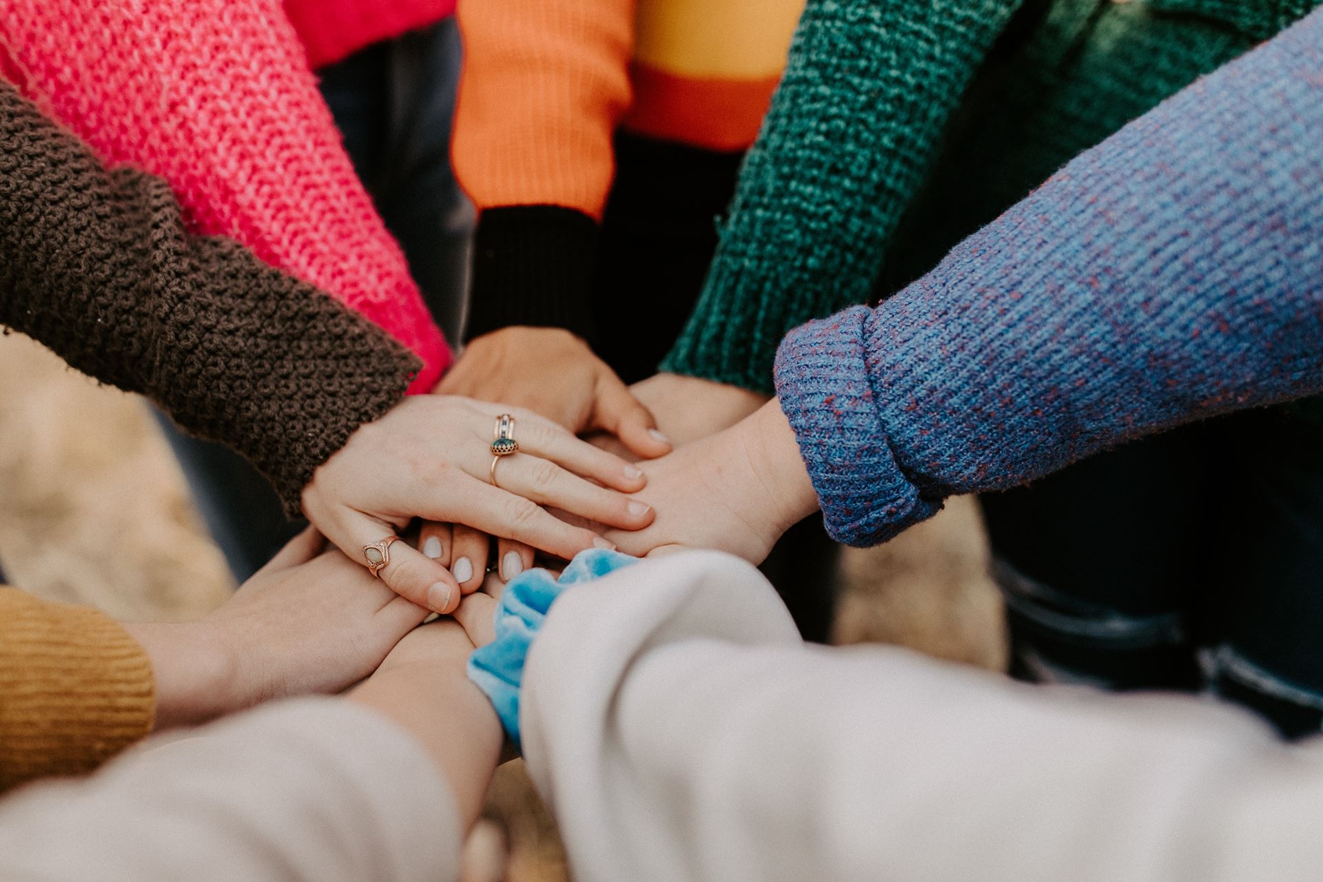 several hands touching